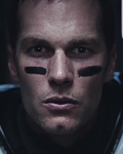A Close Up Of A Football Player 'S Face With Black Stripes On His Face GIF