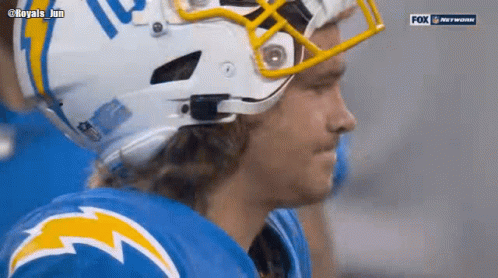 A Close Up Of A Football Player Wearing A Helmet GIF