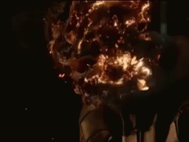 A Close Up Of A Ghost Rider 'S Head With Fire Coming Out Of It . GIF