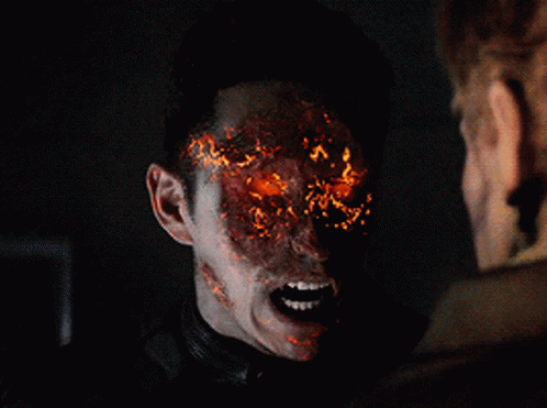 A Close Up Of A Ghost Rider With Fire Coming Out Of His Face GIF