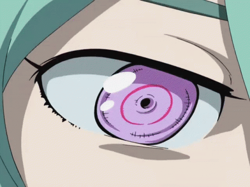 A Close Up Of A Girl 'S Eye With A Purple Circle In The Middle GIF