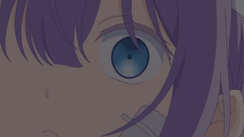A Close Up Of A Girl 'S Eye With Purple Hair GIF