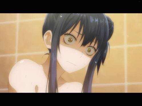 A Close Up Of A Girl 'S Face In A Bathtub With A Yellow Tile Background GIF
