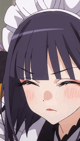 A Close Up Of A Girl 'S Face Wearing A Maid Costume GIF