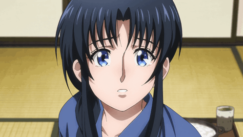 A Close Up Of A Girl 'S Face With A Blue Shirt On GIF