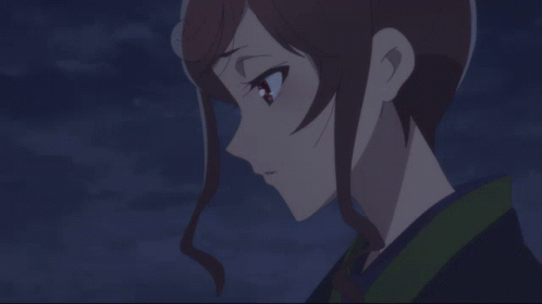 A Close Up Of A Girl 'S Face With A Dark Background GIF
