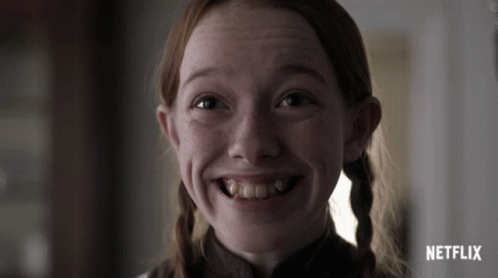 A Close Up Of A Girl 'S Face With A Netflix Logo Behind Her GIF