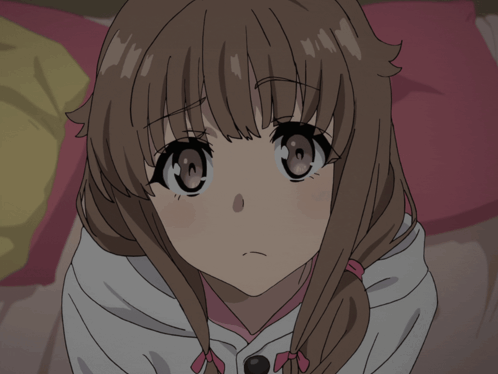 A Close Up Of A Girl 'S Face With A Pink Bow In Her Hair GIF