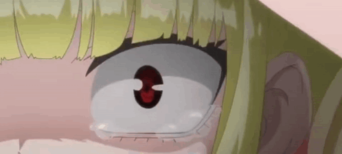 A Close Up Of A Girl 'S Face With A Red Eye And Tears Coming Out Of Her Eyes . GIF