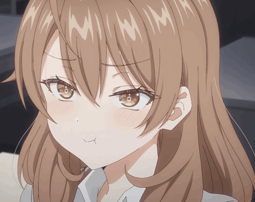A Close Up Of A Girl 'S Face With A Slight Smile On Her Face GIF