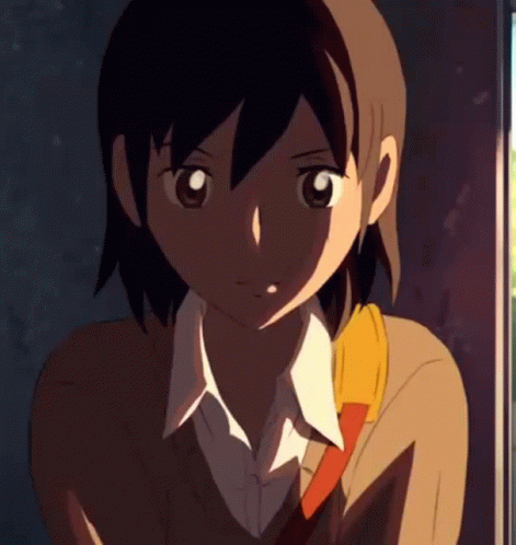 A Close Up Of A Girl 'S Face With A Yellow Scarf Around Her Neck GIF