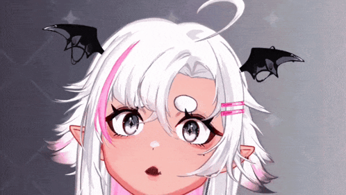 A Close Up Of A Girl 'S Face With Bat Wings On Her Ears GIF