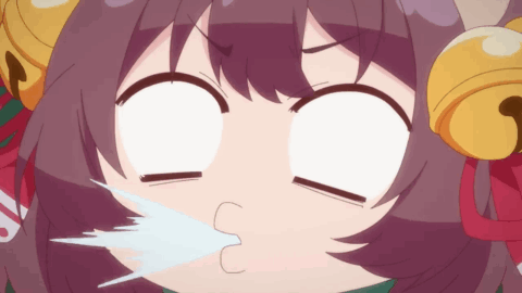 A Close Up Of A Girl 'S Face With Bells On Her Ears Making A Funny Face GIF