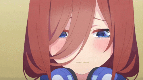 A Close Up Of A Girl 'S Face With Blue Eyes GIF