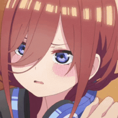 A Close Up Of A Girl 'S Face With Blue Eyes GIF