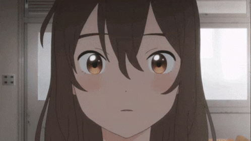 A Close Up Of A Girl 'S Face With Brown Eyes And Long Hair GIF