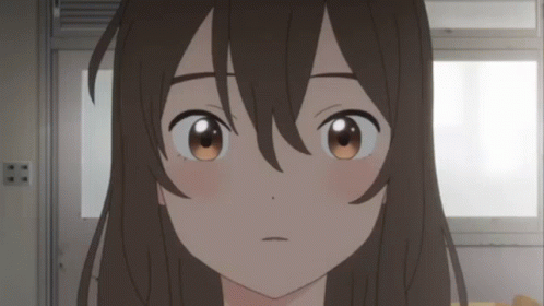 A Close Up Of A Girl 'S Face With Brown Eyes And Long Hair GIF