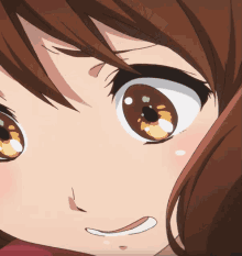 A Close Up Of A Girl 'S Face With Brown Hair GIF