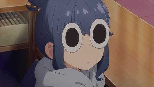 A Close Up Of A Girl 'S Face With Circles In Her Eyes GIF