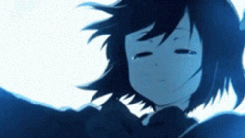 A Close Up Of A Girl 'S Face With Her Eyes Closed . GIF