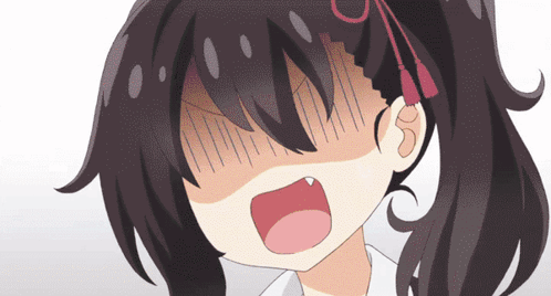 A Close Up Of A Girl 'S Face With Her Mouth Wide Open GIF
