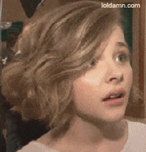A Close Up Of A Girl 'S Face With Loldamn.com Written On The Bottom Right GIF