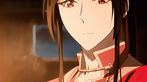 a close up of a girl 's face with long hair and red eyes