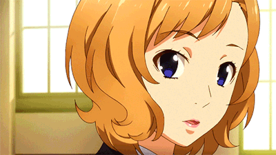 A Close Up Of A Girl 'S Face With Orange Hair GIF