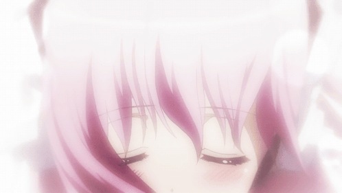 A Close Up Of A Girl 'S Face With Pink Hair And Black Eyes GIF