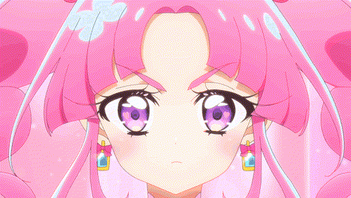 A Close Up Of A Girl 'S Face With Pink Hair And Purple Eyes GIF