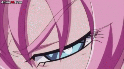 A Close Up Of A Girl 'S Face With Purple Hair And Blue Eyes . GIF