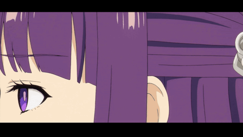 A Close Up Of A Girl 'S Face With Purple Hair And Blue Eyes GIF