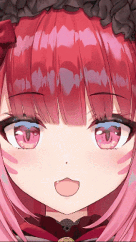 A Close Up Of A Girl 'S Face With Red Hair And Blue Eyes GIF