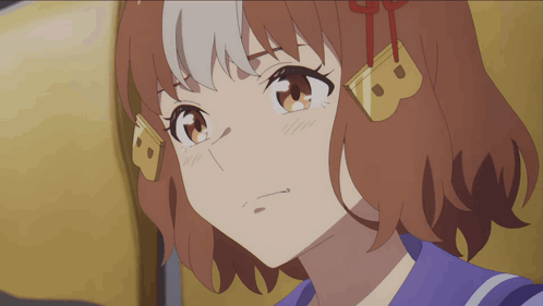 a close up of a girl 's face with the letter b on her head