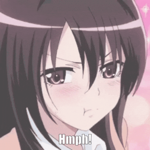 A Close Up Of A Girl 'S Face With The Words Hmph Written Below It GIF