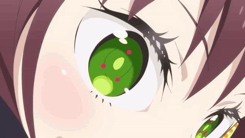 A Close Up Of A Girl 'S Green Eye With Red Dots GIF