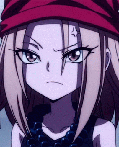 A Close Up Of A Girl Wearing A Red Hat And A Necklace GIF