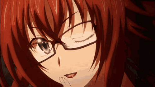 A Close Up Of A Girl Wearing Glasses With Red Hair GIF