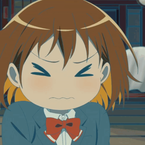 A Close Up Of A Girl With A Bow Tie Making A Funny Face GIF