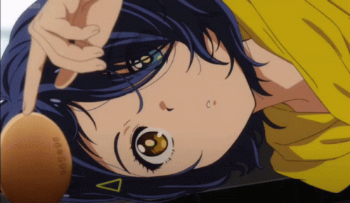 A Close Up Of A Girl With A Yellow Shirt And A Triangle On Her Head GIF