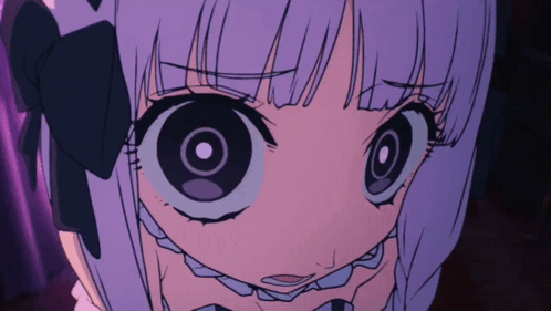 A Close Up Of A Girl With Big Eyes GIF