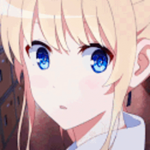 A Close Up Of A Girl With Blonde Hair And Blue Eyes . GIF