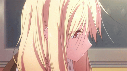A Close Up Of A Girl With Blonde Hair And Red Eyes GIF