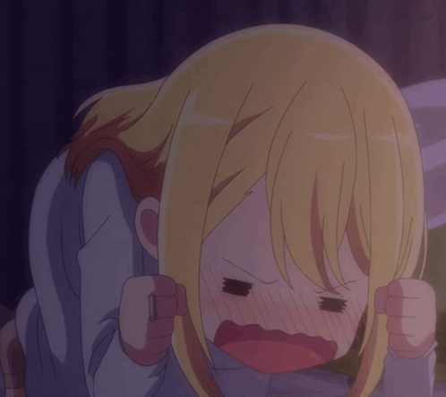 A Close Up Of A Girl With Blonde Hair Making A Funny Face GIF