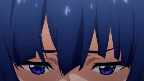 A Close Up Of A Girl With Blue Eyes GIF