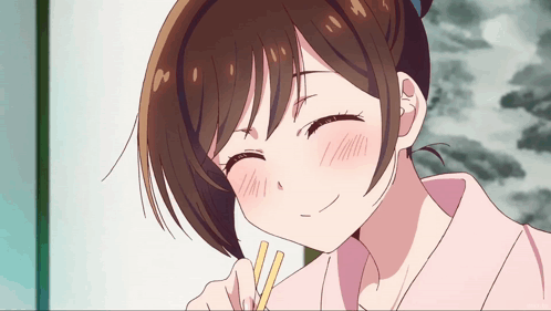 A Close Up Of A Girl With Chopsticks In Her Hand GIF