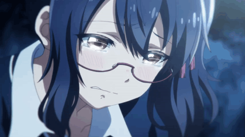 A Close Up Of A Girl With Glasses And Blue Hair Crying GIF
