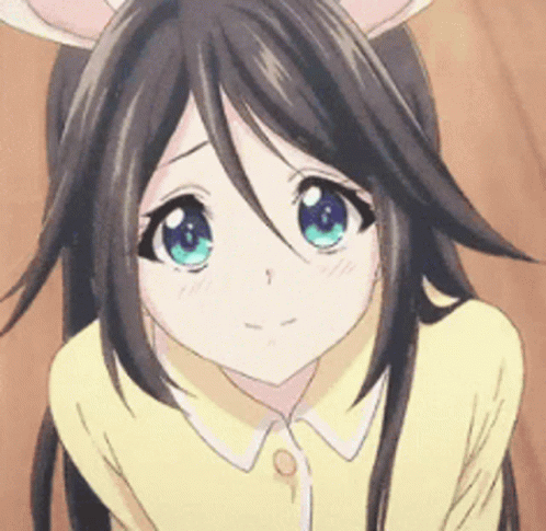 A Close Up Of A Girl With Long Hair And Blue Eyes GIF