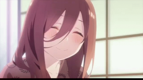 A Close Up Of A Girl With Long Hair Smiling GIF