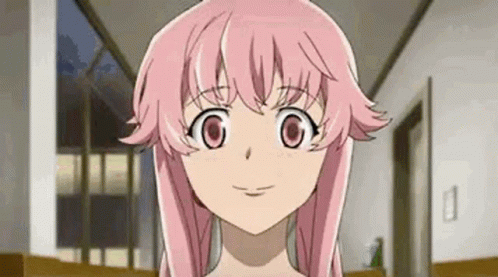 A Close Up Of A Girl With Pink Hair And Big Eyes . GIF